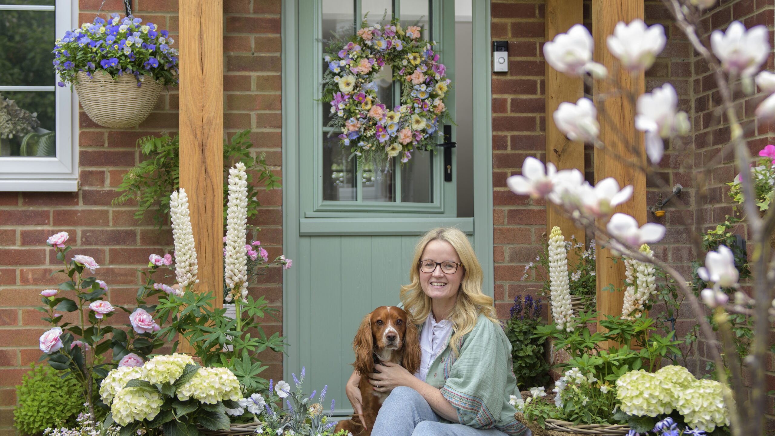 Aimee's Flint Beeston Composite Stable Door in Chartwell Green with her dog in front of the open door